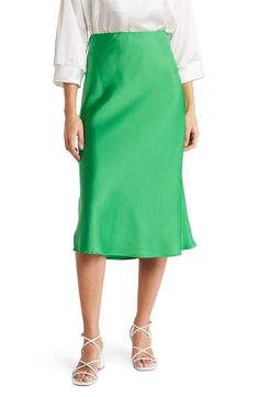 Elevate your wardrobe with this pull-on bias satin midi skirt for elegant, feminine style. 31" length (size S) Elasticized waist Pull-on style Satin construction 97% polyester, 3% spandex Machine wash cold, line dry Made in USA Model’s stats for sizing: 5’10” height, 34” bust, 27” waist, 35” hips. Model is wearing size S. Bright Green Skirt Outfit, Satin Flowy Skirt For Work, Solid Satin Skirt For Workwear, Flowy Satin Skirt For Workwear, Chic Satin Skirt For Spring, Spring Formal Satin Skirt, Relaxed Silk Midi Pencil Skirt, Satin Flared Skirt For Work, Flared Satin Skirt For Workwear