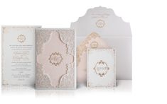 the wedding stationery is set up in white with gold foilwork and embellishments