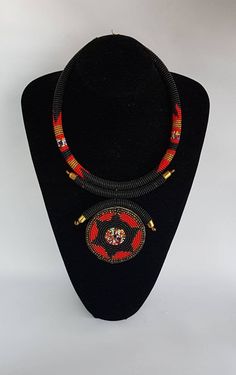 100% handcrafted using fine beads. The necklace makes a perfect gift. This necklace is approximately 17 inches long and 4 inches pendant. **Buy multiple items and pay shipping for 1 item only.The rest ships free. More neckleces here; https://www.etsy.com/shop/TribalTess?ref=seller-platform-mcnav&section_id=21306083 Back to my shop; https://www.etsy.com/shop/TribalTess?ref=seller-platform-mcnav Traditional Black Beaded Necklaces As Gift, Traditional Black Beaded Necklaces For Gift, Artisan Red Beaded Necklace With Black Beads, Traditional Beaded Necklace With Polished Round Pendant, Traditional Beaded Necklace With Round Pendant, Gift Pendant Beaded Necklaces With Large Beads, Traditional Handmade Medallion Necklace Gift, Traditional Handmade Round Medallion Necklace, Traditional Black Beaded Pendant Necklace