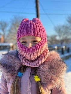 Keep your little one warm and stylish this winter with our knitted baby balaclava hat! This hat is made with soft, high-quality yarn and is available in a variety of colors. This hat is perfect for keeping your child's face and head warm in cold weather. The snug fit helps to seal out the cold, and the soft yarn is gentle on your child's skin. This hat is also a great fashion statement. The vibrant pink color is sure to turn heads. Crochet Ski Mask, Balaclava Knit, Balaclava Crochet, Balaclava Ski Mask, Crochet Balaclava, Knit Balaclava, Knitted Balaclava, Ski Mask, Knitted Baby