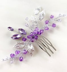 Introducing our Lilac Crystal and Silver Leaf Hair Comb - a radiant accessory that effortlessly combines sophistication with a touch of whimsy. Handcrafted to perfection, this hair comb features sparkling lilac crystals and delicate silver leaves, creating a stunning addition to any hairstyle. Adorning the comb are captivating lilac crystals that sparkle with an enchanting brilliance. The soft, feminine hue adds a touch of elegance and charm, making it a versatile accessory for various occasions Lilac Bridesmaid, Flower Girl Hair, Pearl Accessories, Silver Leaves, Flower Girl Hairstyles, Soft Feminine, Charm Making, Girl Hair, Silver Leaf