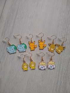 ❤ INFORMATION ❤  These funny earrings have golden plated hooks. There are different variants available. The earrings are a nice colorful addition to any outfit, for a cheerful look for yourself or as an original gift for someone else! Sold per pair and you will receive the earring stoppers.  The size of the Bul charm is 21x23 mm.  The size of the Pika yellow charm is 19x22 mm.  The size of the Pika black charm is 21x20 mm.  The size of the Eev charm is 21x20 mm.  The size of the Duck charm is 13 Gold Novelty Drop Earrings, Novelty Gold Nickel-free Earrings, Nickel-free Gold Novelty Earrings, Nickel-free Novelty Gold Earrings, Handmade Kawaii Gold Jewelry, Kawaii Gold Nickel-free Jewelry, Kawaii Nickel-free Gold Jewelry, Handmade Gold Kawaii Jewelry, Gold Nickel-free Kawaii Jewelry