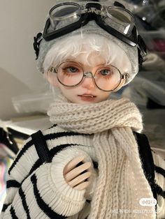 a mannequin wearing glasses and a sweater