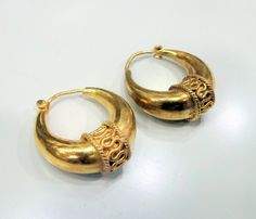 Vintage 14 K solid Gold Hallmarked Hoop Earrings Pair. Size-2.5 cm, weight of pair-18 grams. Traditional Engraved Round Hoop Earrings, Traditional Engraved Hoop Earrings, Traditional Hallmarked Round Hoop Earrings, Yellow Gold Crescent Hoop Earrings, Traditional Formal Hoop Earrings For Pierced Ears, Traditional Small Hoop Earrings For Anniversary, Traditional Small Hoop Earrings For Anniversaries, Ceremonial Yellow Gold Hoop Earrings, Traditional Small Hoop Hallmarked Earrings