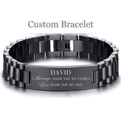 an engraved bracelet with the words,'custom bracelet'in black and silver on it