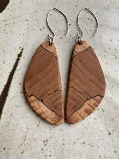 Earrings by juried Kentucky Crafted artist Wesley Page.  Wesley carefully selects each piece of wood for character and color.  All earrings are expertly and artistically matched by grain pattern, which is a fine, skilled art.   All earrings are: * Made with Kentucky hardwoods * Lightweight and of high quality * Set in Argentium silver * Finished with our natural recipe using local beeswax Natural Wood Nature-inspired Jewelry, Unique Natural Wood Earrings, Unique Natural Wood Jewelry, Natural Wood Jewelry With Variations, Earthy Wooden Jewelry Gift, Earthy Wood Jewelry Gift, Earthy Wood Jewelry As Gift, Handmade Wood Drop Earrings, Handmade Wooden Drop Earrings