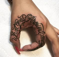 a woman's hand with the word happy birthday written in cursive writing on it