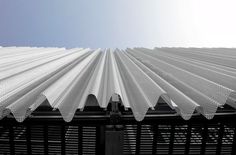 the roof of a building with metal slats on it