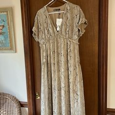 New; Low High Design; Lined. Measurements: Pit To Pit Is 18-19 Inches; Length On The Front Is 48 Inches And It’s Longer On The Back (Last Photo). Bl2 Zara Beige Flowy Dress, Zara Brown V-neck Dress, Zara Brown V-neck Maxi Dress, Beige V-neck Maxi Dress By Zara, Zara Brown Short Sleeve Dress, Zara Gold, High Design, Zara Dress, Higher Design