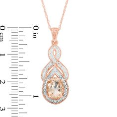 Take her breath - and her speech - away with this glittering vintage-inspired gemstone pendant. Crafted in precious 10K rose gold, this exquisite look showcases an 8.0 x 6.0mm oval-shaped soft-pink morganite nestled neatly inside a dazzling teardrop-shaped frame lined with sparkling diamond accents. A lovely infinity symbol-shaped ribbon glistens with beautiful beading above the center stone, while intricate milgrain details create a shimmering outline around the centerpiece and topper. A dainty beaded bail completes this winsome choice. Buffed to a brilliant luster, this pendant suspends along an 18.0-inch rope chain that secures with a spring-ring clasp. Elegant Infinity Jewelry With Accent Stones, Infinity Top, Morganite Diamond, Pink Morganite, Sparkling Diamond, Infinity Symbol, Sparkle Diamonds, Rope Chain, Morganite