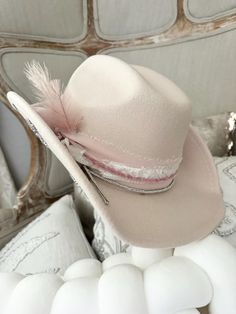 Women's cowboy hat  Boots not included  Decorative 100% polyester cowboy hat.  Geo quarts charm attached One size fits most  56-58  Adorable   All sales final. Birthday girl, bride to be, bachelorette fun.  Need a different color ? Message me. Ivory hat, pinks, whites and creams silver stars under brim Custom Cowgirl Hat Ideas, Boho Cowboy Hat, Fitted Western Pink Hat, Pink Western Hat For Ranch, Pink Country Style Hat For Ranch, Pink Wide Brim Mini Hats For Rodeo, Country Style Pink Hat For Ranch, Pink Country-style Hat For Ranch, Pink Western Felt Hat For Rodeo