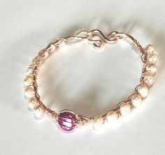 Soft pink freshwater pearl wire wrapped bangle Wire Wrapped Pearl Bracelet, Rose Gold Pearl Jewelry With Wire Wrapped Detail, Elegant Pink Wire Wrapped Bracelets, Rose Gold Wire-wrapped Copper Bracelets, Elegant Copper Wire Bangle Bracelets, Handmade Rose Gold Pearl Bracelet, Adjustable Handmade Rose Gold Pearl Bracelet, Wire Wrapped Pearl, Wire Wrapped Bangles