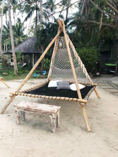 a hammock set up in the sand