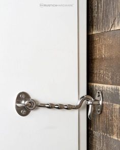 a door handle on the side of a white door