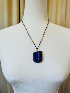 A gorgeous piece of asymetrical Lapis Lazuli on a lapis faceted, gold filled bead chain.  The crystal is hand-drilled and secured with resin for durability. The lapis is 1.5 inches long by 1.25 inches wide and the chain is 20 inches end to end with a 2 inch extender. 💙Metaphysical Properties: A stone of wisdom, intuition, and truth. Lapis Lazuli is known as a powerful crystal for anyone seeking to deepen their connection to self. Lapis Lazuli are known for opening the third eye chakra, the center of intuition and inner wisdom. By enhancing your ability to turn inward and uncover your truth, the energy of the Lapis Lazuli crystal  can support anyone ready to step into their power and authentic self.  This stone was used throughout the Hathor temples in ancient Egypt 💙 **All crystals are h Faceted Blue Lapis Lazuli Necklace, Blue Faceted Lapis Lazuli Beaded Necklaces, Blue Faceted Lapis Lazuli Beaded Necklace, Faceted Sapphire Lapis Lazuli Necklace, Lapis Lazuli Jewelry With Faceted Beads, Healing Lapis Lazuli Jewelry With Faceted Beads, Spiritual Lapis Lazuli Jewelry With Faceted Beads, Sapphire Beaded Necklaces With Natural Lapis Lazuli Stones, Lapis Lazuli Faceted Beads Jewelry For Gift