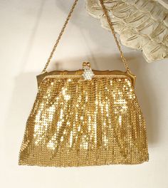 I was beyond thrilled when I found this purse Offering an absolutely stunning very high quality vintage 1940s era liquid gold mesh and crystal rhinestone, and simulated pearl Art Deco flapper evening bag/wristlet clutch purse in near PRISTINE vintage condition made by legendary designers Whiting & Davis.  This purse will be as perfect with a pair of jeans and a tee as it will with a Bridal gown. If you've ever seen one of these purses in person you know that photos are not doing it justice as th Vintage Evening Bag For Vintage Events, Vintage Evening Bag For Events, Vintage Rectangular Evening Bag For Party, Gold Vintage Bag For Events, Antique Clutch Evening Bag For Vintage Events, Vintage Clutch Evening Bag For Events, Antique Style Clutch For Vintage Events, Vintage Handheld Evening Bag For Weddings, Vintage Handheld Evening Bag For Party