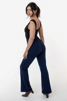 The Ponte Flared Legging is our updated take on the classic jazz pant. These pants are made of a smooth, heavyweight Ponte fabric that stretches and flatters your curves. These leggings are high waisted, fitted through the thigh and flare slightly towards the ankles. We've given this style a half inch elastic waistband for a seamless look without any extra bulk. This versatile legging can be styled like a trouser with your favorite mid-length blouses and cropped sweaters and finished with a stra Basic Crop Tops, Cropped Sweaters, Jazz Pants, Classic Jazz, Flare Legging, Nyc Design, Dance Pants, Ponte Fabric, Navy And Brown