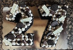 the cake is decorated with oreo and white chocolate