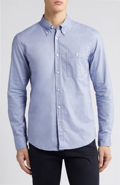 Comfortable and versatile, this solid-color shirt tailored from soft cotton looks great whether you wear it tucked or untucked. 30" length; 40" chest (size Medium) Front button closure Button-down collar Long sleeves with button cuffs Chest button-patch pocket 100% cotton Dry clean or machine wash, dry flat Imported Casual Cotton Button-up Dress Shirt, Blue Cotton Dress Shirt With Pockets, Cotton Button-up Dress Shirt With Placket, Cotton Shirt With Button Cuffs For Work, Casual Cotton Dress Shirt With Pockets, Blue Cotton Shirt With Placket, Cotton Shirt With Buttoned Pockets, Slim Fit Solid Cotton Shirt, Solid Cotton Slim Fit Shirt