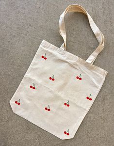 "A simple and super cute cherry tote! Made with Heat Transfer Vinyl Tote info: 15\"x15\" Length and Width 21\" Handles Web Handles Bottom gusset  Please allow 5-7 business days for our processing time as all of our totes are handmade! :) Message for any questions!" Simple Bag Design Ideas, Simple Bag Design, Fruit Tote Bag Painting, Tout Bag Ideas, Tote Bag Design Ideas Paint Easy, Cute Canvas Tote Bags, Simple Tote Bag Design Paint, Easy Tote Bag Design, Diy Tote Bag Painting Ideas Summer