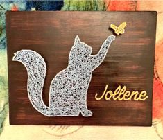 a string art squirrel with the word joleene on it's back and a yellow butterfly