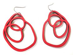 These beautiful red laser cut wood earrings make a statement! Perfect to go with any outfit. The geometric hoop shapes are laser cut out of lightweight wood and measure 55mm by 41mm. You can choose surgical stainless steel hooks or solid sterling hooks. Red Scribble, Wood Hoop Earrings, Laser Cut Wood Earrings, Laser Cut Jewelry, Repurposed Jewelry, Buy Earrings, Wooden Hoop, Filigree Earrings, Stud Jewelry