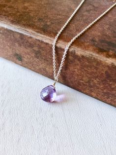 Amethyst Necklace, February Birthstone, Purple Amethyst Teardrop Pendant, Minimalist Jewelry in Gold or Silver, Delicate Gift for February This simple and classy necklace features a micro faceted purple Amethyst teardrop wire wrapped to a dainty chain in your choice of gold filled or sterling silver. This minimalist necklace is ideal for every day wear, and it makes a wonderful gift for a girl born in February, as this is their birthstone. Popular choice for bridesmaids necklaces, this necklace Purple Teardrop Gemstone Necklace, Minimalist Teardrop Birthstone Crystal Necklace, Minimalist Teardrop Gemstone Charm Necklaces, Purple Teardrop Drop Necklace As Gift, Purple Teardrop Pendant Necklace For Jewelry Making, Purple Teardrop Necklaces For Jewelry Making, Amethyst Teardrop Necklace For Healing, Purple Teardrop Necklace For Jewelry Making, Purple Teardrop Pendant For Jewelry Making