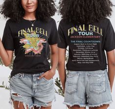 two women wearing black t - shirts with the final tour written on them, standing next to each other