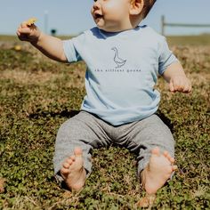 Silly Goose Baby Tee Silliest Goose Infant Shirt for Silly Goose Birthday Party Baby Silly Goose Theme Party Shirt Goose Family Shirt Striking the balance between comfort and toddler durability, this infant shirt features a simple goose graphic with the words "the silliest goose" underneath. Available in white, light blue, navy, pink, and hot pink. The graphic on all shirts is in navy, with the exception of the navy shirt.  With A Wildflower aims to blend style and faith, modern and vintage, for Family Matching Cotton Shirt For Playtime, Cute Short Sleeve Shirt For First Birthday, Blue Summer T-shirt For First Birthday, Blue Cotton T-shirt For First Birthday, Blue Short Sleeve T-shirt For First Birthday, Playful Crew Neck Top For First Birthday, Fun Cotton Tops For First Birthday, Fun Blue Top For First Birthday, Playful Letter Print Shirt For Playtime