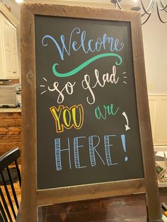 a chalkboard sign that says welcome so glad you are here