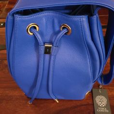 Vince Camuto Dazzling Blue Drawstring Bag Luxury Blue Shoulder Bucket Bag, Luxury Blue Bucket Bag For Daily Use, Luxury Blue Bucket Bag, Luxury Blue Bucket Bag For Shopping, Blue Luxury Pouch Bucket Bag, Luxury Blue Pouch Bucket Bag, Luxury Blue Backpack Bag, Luxury Blue Backpack, Blue Backpack For Shopping