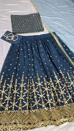 Name :- wedding  special Lehengha   with Dupata Choli : Fabric  :  Georgette  Size     :  UN stitch Work.   : Embroidery with 9 mm Sequence  UN stitch Up to 42 1 meter Moti lace border LEHENGHA : Fabric : Georgette  Inner : Crepe WORK : embroidery with 9 mm Sequence  Size     : XXL Stitching type    : Semi stitch Up to 44  Flair    : 3 meter with cancan and canvas pata😍 Dupata : Fabric :   Net Work   :  embroidery with 9 mm Sequence with  four side lace border Package Details 1 Choli / 1 Leheng Party Choli With Resham Embroidery In Royal Blue, Blue Sharara With Resham Embroidery For Party, Party Choli With Resham Embroidery In Blue, Royal Blue Bollywood Choli With Intricate Embroidery, Blue Fitted Lehenga With Mirror Work, Blue Party Choli With Resham Embroidery, Blue Mirror Work Lehenga For Navratri, Party Blue Choli With Resham Embroidery, Fitted Blue Lehenga With Mirror Work