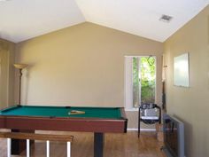 a pool table in the middle of a room