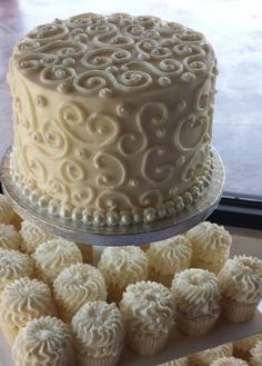 two tiered wedding cake with white frosting