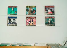 there are many magazines on the wall