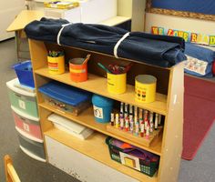 an open book shelf filled with school supplies