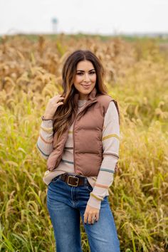 This simple vest is perfect for colder weather. Adding a vest is a quick and easy way to take your outfit to the next level of stylish! Whether you pair with a blouse, sweater, graphic crewneck, button up, or just a basic long sleeve tee, we know this will be a staple piece in your wardrobe!Shell, Lining, & Fill: 100% Polyester Machine wash cold with like colors. Line dry. Fall Sweater Vest For Layering, Trendy Crew Neck Sweater Vest For Fall, Brown Crew Neck Outerwear For Spring, Trendy Winter Sweater Vest For Layering, Trendy Sweater Vest For Winter Layering, Fall Crew Neck Vest, Fall Crew Neck Sweater Vest For Work, Trendy Winter Sweater Vest For Work, Fall Workwear Sweater Vest With Crew Neck