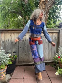 These are an original Zasra design, a one of a kind, handmade, eco friendly, patchwork, repurposed jersey knit pair of wide leg, gaucho pants.   For this particular pair, I selected shades that remind me of Patagonia colors, such as, royal purple, olive, denim blue, soft turquoise, rust,tangerine, off white, navy. I have also made these in a mix of prints, stripes, tie dye, folk floral and solids. The foldable yoga style waistband is made from stretch jersey knit, in a solid navy and also has a Patchwork Pants Outfit, Wide Leg Pants Blue, Hippy Pants, Dye Pants, Soft Turquoise, Patchwork Pants, Folk Floral, Gaucho Pants, Tie Dye Pants