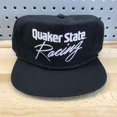 Vintage Quaker State Racing Black Zip Closure Hat Cap 80’s 90’s Era Adjustable. Vintage New Old Stock, Excellent Condition. Being a vintage hat, this hat may show signs of age/storage, see photos for best example of condition. Note, this hat has had it’s tag removed from the sweatband. Ships via USPS First Class Package with Tracking. *Please note, all hats are packaged in plastic clothing bags and have desiccant packs and a small piece of scented dryer sheet to ensure freshness while in storage Retro Black Adjustable Bucket Hat, Retro Adjustable Black Bucket Hat, Retro Black Trucker Hat For Sports, Vintage Black Hat For Outdoor, Vintage Black Outdoor Hat, Vintage Black Baseball Cap With Flat Bill, Retro Black Baseball Cap For Sports Events, Retro Black Snapback Hat For Sports Events, Black Retro Fitted Hat With Flat Brim