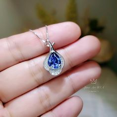 "Full 925 silver Tanzanite necklace decorated with CZ stone Tanzanite jewelry ◆◆Pendant Holder (bezel & Bail) : High Quality 925 Sterling Silver Main Stone:7*9mm Created Tanzanite Whole Pendant Size ( include bail) : 16mm Accent Stone : Cubic Zirconia ◆◆ Necklace chain : Platinum coated 925 sterling silver Box Chain from 16\" to 20\" The model wearing the default size with 18\". Please pay attention to the size Some photos have been enlarged to show details. And others need to minimize for f Blue Gemstone Necklace, Tanzanite Pendant, Tanzanite Necklace, Tanzanite Jewelry, Zirconia Necklace, Cubic Zirconia Necklace, Emerald Pendant, Cz Pendant, Silver Box