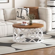 a living room with a white couch and coffee table