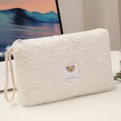 Keep your essentials organized in style with our Fuzzy Pencil Case Storage Bag! Perfect for a variety of uses, from a chic cosmetic bag to an efficient baby item organizer, this versatile storage solution is a must-have for anyone who appreciates both function and fashion. Crafted from plush material, this storage bag offers a soft, tactile experience that is both delightful to touch and visually appealing. Its large capacity design ensures that you can store everything from makeup and lipsticks to baby items and small toys, making it an ideal companion for your daily needs or travel adventures. Imagine having all your essential items neatly organized in one stylish, easy-to-carry bag. Whether you're a busy mom needing a quick diaper bag organizer or a beauty enthusiast looking for a chic Make Up Kits, Portable Makeup Storage, Diaper Bag Organization, Pencil Case Pouch, Makeup Kits, Travel Women, Cosmetic Bag Organization, Small Cosmetic Bags, Handbag Organization