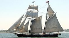 a large sailboat sailing in the ocean