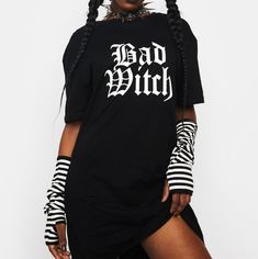 Dolls Kill Nwt!! "Bad Witch" Oversized T-Shirt / Dress - Size: Small - Color: Black With White Print - Fabric: 100% Cotton Approx Measurements: - Pit To Pit: 18.5in - Shoulder Seam To Seam: 18.5in - Length: 30.75in * Note: First And Last Images Are Stock Pics Used To Show Style/ Fit. All Other Pics Are Mine And Show The Actual Shirt For Sale. Cotton Dresses For Streetwear, Black Cotton T-shirt Dress With Graphic Print, White T-shirt For Alternative Fashion, Punk Style Short Sleeve Dresses For Alternative Fashion, Short Sleeve Punk Dresses For Alternative Fashion, Edgy Short Sleeve Fall Dresses, Crew Neck Cotton Streetwear Dress, Edgy Short Sleeve Dresses For Fall, Cotton Crew Neck Streetwear Dress