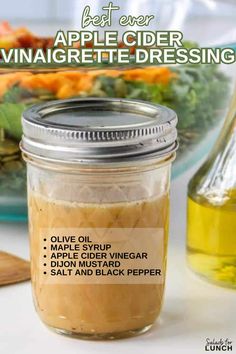 an apple cider vinaigrette dressing recipe in a jar with ingredients on the side