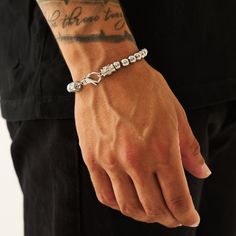 A master in disguise. With discreet emblem embellishment and a reinforced lobster clasp, there’s more to this bracelet than meets the eye. Built to be worn on repeat, each Silver sphere is hand-strung on a hidden metal chain, ensuring durability and a clean everyday aesthetic. ✓ 316L Stainless Steel & Rhodium✓ Water, Heat, Sweat Resistant✓ Hypoallergenic (No Green Skin)Model is 5'11 & Wears 19cm Length. Modern Adjustable White Gold Beaded Bracelets, Elegant Stainless Steel Beaded Bracelets For Everyday, Minimalist Silver Metal Charm Bracelet, Silver Jewelry With Box Chain And Round Beads, Modern Metal Beaded Bracelets For Everyday, Modern Metal Beaded Bracelets For Everyday Wear, Everyday Silver Jubilee Chain Bracelet, Metal Link Bracelet With Sterling Silver Clasp, Silver Chain Link Bracelets For Everyday