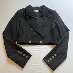 Size Small. May Fit A Medium. In Excellent Condition No Flaws. Bust: 17” Length: 14.75” Black Single-breasted Cropped Office Jacket, Black Single-breasted Tailored Cropped Jacket, Black Tailored Cropped Jacket With Lapel Collar, Black Single Breasted Cropped Jacket With Lapel Collar, Black Single-breasted Cropped Jacket With Lapel Collar, Tailored Black Cropped Jacket For Work, Black Tailored Cropped Jacket For Work, Chic Tailored Cropped Jacket With Long Sleeves, Chic Tailored Long Sleeve Cropped Jacket