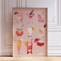 a pink poster with different types of cocktails on it in front of a white wall