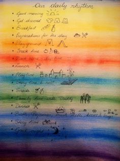 a rainbow colored paper with writing on it