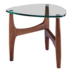 a table with a glass top and wooden legs